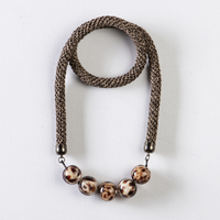 necklace ofri blacl & gold with five beads round shap