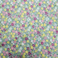 אריג כותנה דפוס פרחים שמחים על רקע טורקיז