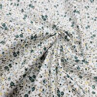 אריג כותנה פרחים קטנים בגווני ירוק דגם שרון