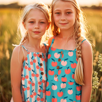 אריג כותנה דפוס פירות על רקע פטרול בהיר