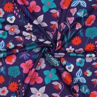 אריג כותנה דפוס מגנוליות על רקע סגול כהה נרידה הנסן