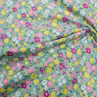 אריג כותנה דפוס פרחים שמחים על רקע טורקיז