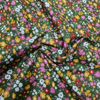 אריג כותנה דפוס פרחים שמחים על רקע ירוק דגם אתי