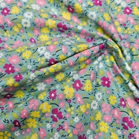 אריג כותנה דפוס פרחים שמחים על רקע טורקיז