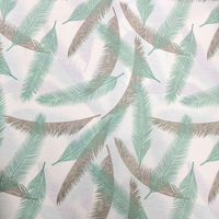 אריג כותנה דפוס נוצות בגווני מנטה אפור