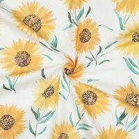 אריג כותנה דפוס פרחי חמניות על רקע לבן