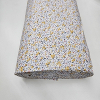 אריג כותנה פרחים קטנים בגווני צהוב דגם שרון