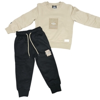 חליפה פוטר מדוגמת UMBRO בנים 2-8 (שחור/אופוויט)