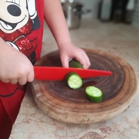 Red chef's knife made of durable and non-toxic plastic