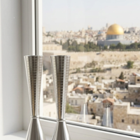 Candlesticks in a smooth design made of pure silver, handmade on a Jerusalem windowsill