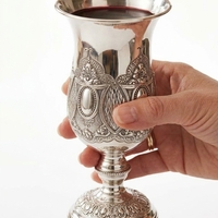 Hand holding a pure silver Kiddush cup – Premium model, 235 ml | Magnificent, ornate Kiddush cup