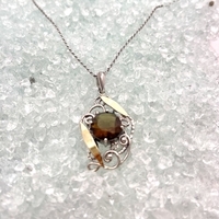 Antique style silver pendant with gold inlay in smokey gold