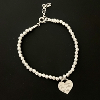 Laser cut ball silver bracelet with heart pendant with personal engraving