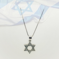 Star of David silver pendant inlaid with zircons