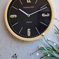 שעון קיר צהוב רקע שחור