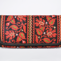 Embroidered purse with red flowers