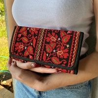 Embroidered purse with red flowers