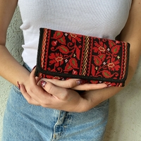 Embroidered purse with red flowers