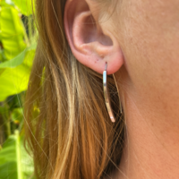 Thin open silver colored earrings