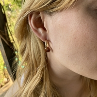 Gold plated hoop earrings with a stone bead - sparkling red