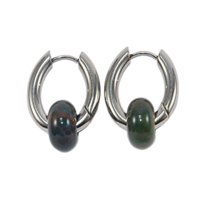 Silver hoop earrings with a green stone bead