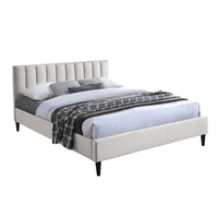 מיטה זוגית מעוצבת עץ מלא מרופדת דגם פולי קרם