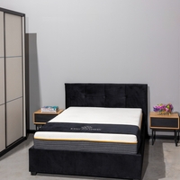 מיטה זוגית מעוצבת בריפוד בד קטיפתי עם ארגז מצעים מעץ דגם ברזיל שחור