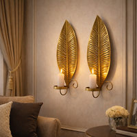 סט פמוטי קיר בצורת עלה – מחזיקי נרות ממתכת בגימור זהב