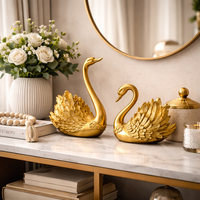 זוג פסלים ברבורים זהב דקורטיביים