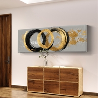 תמונת קנבס פנורמית אבסטרקטית עם מעגלים בגווני שחור וזהב על רקע אפור בעיצוב מודרני ויוקרתי