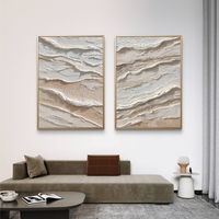 סט תמונות קנבס זוגיות בגווני שמנת ובז’ בעיצוב שכבות טבעיות ומינימליסטיות