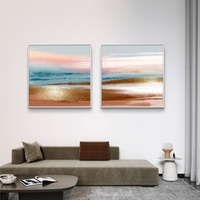 זוג תמונות קנבס מרובעות בגווני פסטל עדינים המדמים שקיעה רגועה – תכשיט לבית