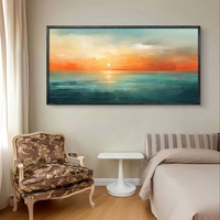 תמונת קנבס לרוחב עם שקיעה אבסטרקטית מעל הים בגווני תכלת, כתום וחול בעיצוב רגוע ואלגנטי