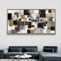 תמונת קנבס אבסטרקטית עם בלוקים גיאומטריים בגווני שחור, לבן, אפור וזהב