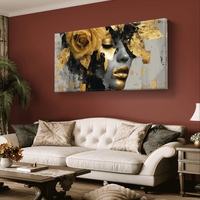 תמונת קנבס לרוחב עם דיוקן נשי דרמטי בגווני שחור וזהב ועיטורי עלי זהב