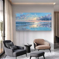 תמונת זכוכית לרוחב של שקיעה מעל הים עם השתקפות מים בגווני כחול וזהב בעיצוב יוקרתי