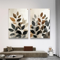 תמונת זכוכית זוג בוטנית עם עלים בשכבות שקופות בגווני אדמה טבעיים.