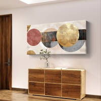 תמונת קנבס לרוחב בעיצוב אבסטרקטי עם מעגלים חופפים בגווני שמנת, זהב ואפור על רקע בהיר.