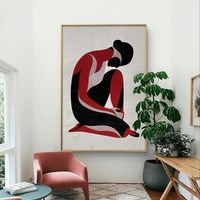 תמונת קנבס עם דמות נשית מינימליסטית בגווני שחור ואדום בעיצוב מודרני