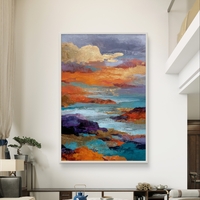 תמונת קנבס אבסטרקטית עם נגיעות זהב וגווני כחול וכתום, בהשראת ים ושקיעה בעיצוב מודרני