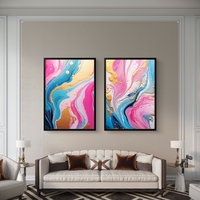 תמונת קנבס זוגית אבסטרקטית בגווני ורוד, תכלת וזהב בעיצוב יוקרתי לסלון