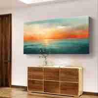 תמונת קנבס לרוחב עם שקיעה אבסטרקטית מעל הים בגווני תכלת, כתום וחול בעיצוב רגוע ואלגנטי