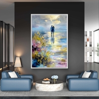 תמונת קנבס אומנותית של זוג עומד מול מים ושמיים בגוונים כחולים וזהב עם מראה ציורי ועדין