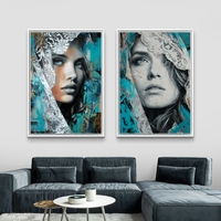 תמונת קנבס זוגית עם דיוקנאות נשיים אמנותיים בגווני טורקיז ושחור עם נגיעות תחרה
