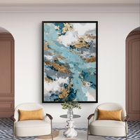 תמונת קנבס אבסטרקטית בגווני תכלת, כחול ולבן עם נגיעות זהב בעיצוב יוקרתי ואלגנטי לבית