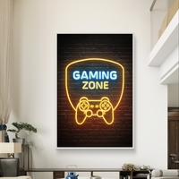 תמונת קנבס עם כיתוב Gaming Zone בעיצוב ניאון ובקר משחק על רקע כהה, מתאימה לחדר גיימינג וחדר נוער