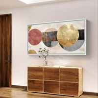 תמונת קנבס לרוחב בעיצוב אבסטרקטי עם מעגלים חופפים בגווני שמנת, זהב ואפור על רקע בהיר.