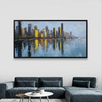 תמונת קנבס לרוחב של קו רקיע עירוני עם השתקפות במים בגווני כחול וזהב, לעיצוב סלון מודרני ואלגנטי