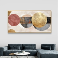 תמונת קנבס לרוחב בעיצוב אבסטרקטי עם מעגלים חופפים בגווני שמנת, זהב ואפור על רקע בהיר.