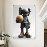 תמונת זכוכית של דמות KAWS שחורה מחזיקה כדורסל, עם נעליים שחורות ושרוכים כתומים – מתוך קולקציית NEXTGEN BY BAR של תכשיט לבית.